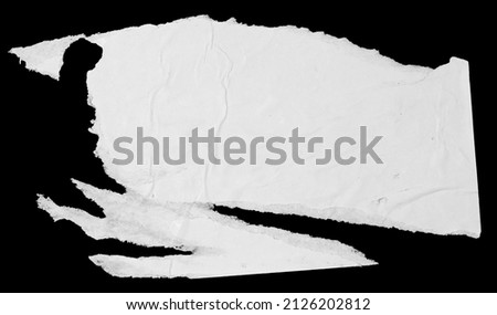 White paper torn piece isolated on black background. Dirty wrinkled glued paper poster texture
