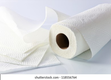 White Paper Towel On A White Reflective Background.