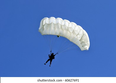 White Parachute On Blue Sky