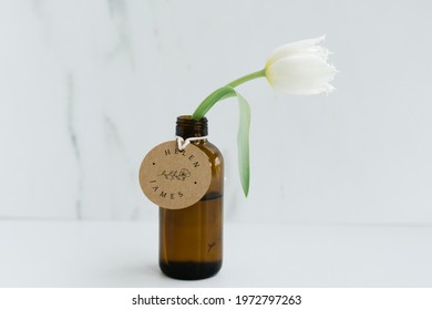 White Parrot Tulip In A Brown Glass Bottle