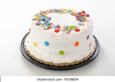 A White Party Cake On A White Table Cloth