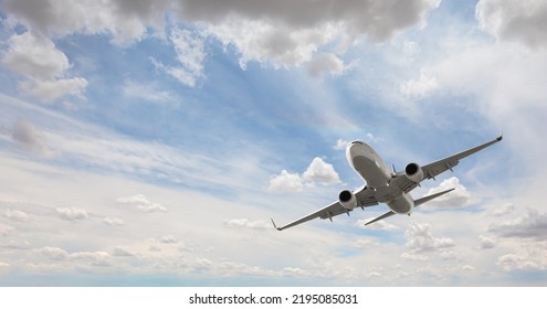 White passenger airplane flying in the sky amazing clouds in the background - Travel by air transport - Shutterstock ID 2195085031