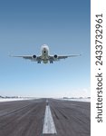 White passenger jet plane take off airport runway at winter