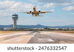 White Passenger plane fly up over take-off runway from airport - El Prat-Barcelona airport. This airport was inaugurated in 1963 - Barcelona, Spain