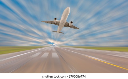 Un avion de passager blanc survole la piste de décollage de l'aéroport 
