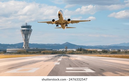 White Passenger plane fly up over take-off runway from airport - El Prat-Barcelona airport. This airport was inaugurated in 1963 - Barcelona, Spain - Powered by Shutterstock