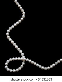 White pearls on the black velvet  background