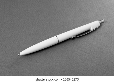 White Pen On A Gray Background