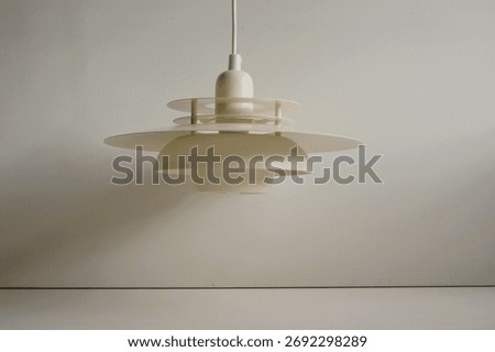 White pendant lamp in multi layer design. Danish Design.