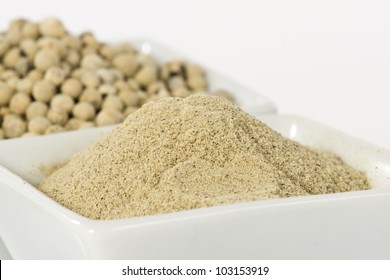 White Pepper Grain And Powder On Ceramic Bowl