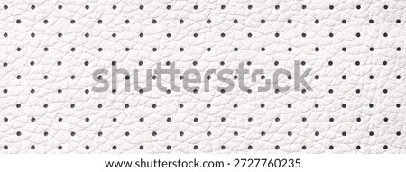 White perforated leather texture background with dotted pattern, macro surface. Upholstery structure fabric backdrop.