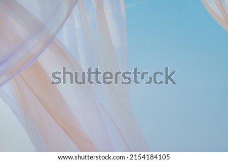 White pergola curtains at seaside as abstract summer holiday background