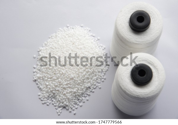 White Pet Chips Semi Dull,PET chips\
recycle,PET polyester chips &Raw White Polyester FDY Yarn\
spool with white\
background