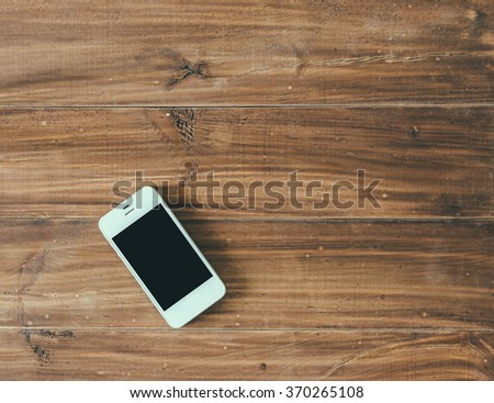 White phone on wood vintage office table