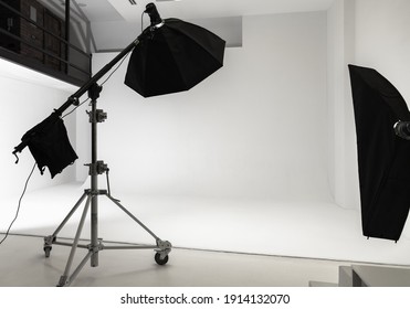 White Photo Studio Interior Background, Cyclorama Structure And Professional Impulse Lights