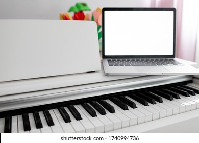 A White Piano With A Laptop On It. Remote Training, Online Education