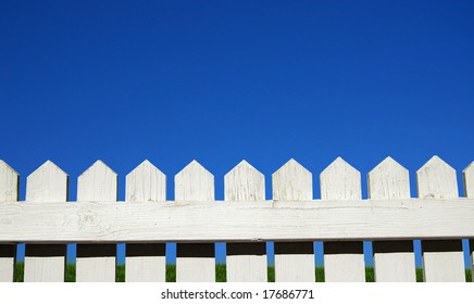 White Picket Fence, Green Grass And Sky