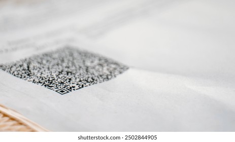 A white piece of paper with a black QR code on it - Powered by Shutterstock - Get 15% off with code: PIKWIZARD15