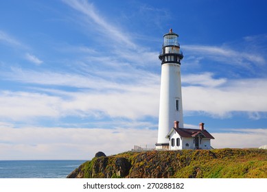 white pigeon point lighthouse with a blue sky in a sunny day