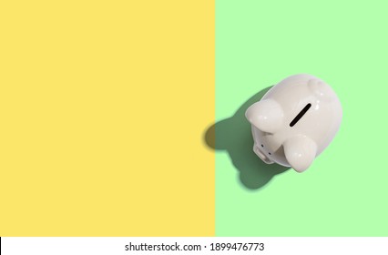 A White Piggy Bank Overhead View Flat Lay