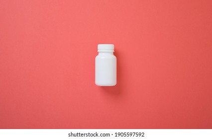 White pill bottle mockup on color background, plastic bottle to  - Shutterstock ID 1905597592