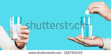 White pill and a glass of water in man hands. Health concept. Close up of man holding a pill. Glass of water tablet. Glass with efervescent tablet in water with bubbles. Imagine de stoc © 