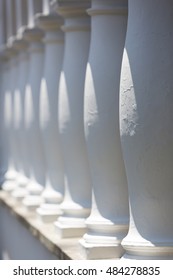 White pillars aligned in a row, architecture details in colonial building in Quito. Ecuador
