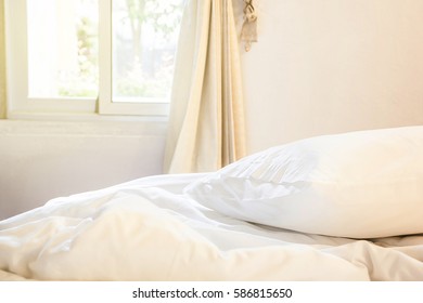 White Pillow And Blanket With Wrinkle Messy On Bed In Bedroom With Lighting Upper Left Side, From Sleeping In A Long Night Winter, An Unmade Bed In Hotel Bedroom With White Blanket. 