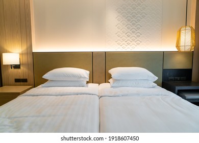 white pillow decoration on bed in hotel resort bedroom