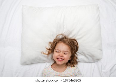 White Pillow Mock Up With Smiling Girl In The Bed