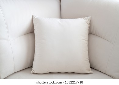 The White Pillow On The Light Sofa