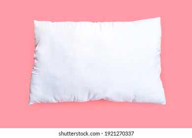 White pillow on pink background.  Top view