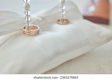 White pillow for wedding rings in a heart - Shutterstock ID 2365270865