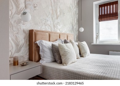 White Pillows, Duvet And Duvet Case On A Blue Bed. White Bed Linen On A Blue Sofa. Bedroom With Bed And Bedding And Poster Frame Mock Up On The Wall. Left Side View.