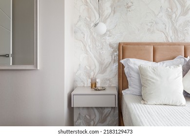 White Pillows, Duvet And Duvet Case On A Blue Bed. White Bed Linen On A Blue Sofa. Bedroom With Bed And Bedding And Poster Frame Mock Up On The Wall. Left Side View.