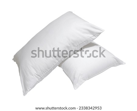 White pillows in stack in hotel or resort room are isolated on white background with clipping path. Concept of confortable and happy sleep in daily life
