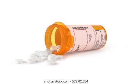 white pills in yellow bottle isolated