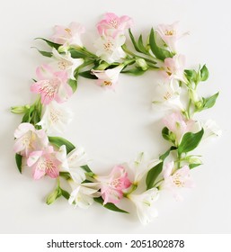 White And Pink Flowers Wreath Top View On White Background With Copy Space. Alstroemeria Flowers Backdrop. Poster