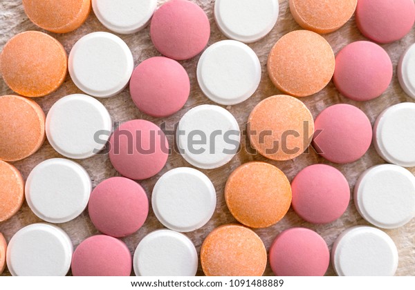 White, pink and\
orange tablets stripes background. Different Antacids medications\
help neutralize stomach acid. Antacid Oral : Uses, Side Effects,\
Interactions, Risks,\
Warnings