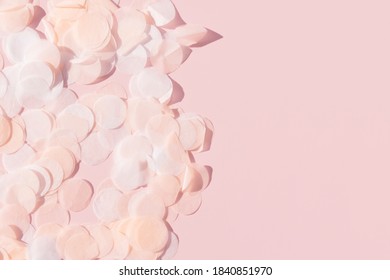 White Pink And Paper Confetti On A Pastel Pink Background Border With Copy Space