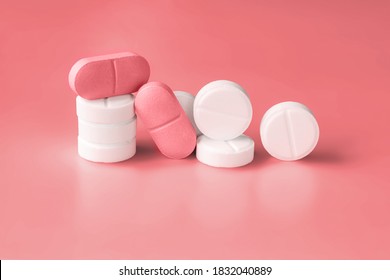 White And Pink Pills On A Red Background. Weight Loss Products, Vitamins, Hormones Or Sedatives. Women's Health Concept. Close-up, Selective Focus. Copy Space