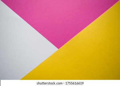 White, Pink And Yellow Background Divided Diagonally