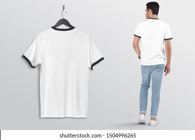 White Plan Men's Ringer T Shirt On A Man In Blue Denim Jeans Pant, Isolated, Mockup. Hanging White Blank Men's Ringer T Shirt, Against Empty Wall.