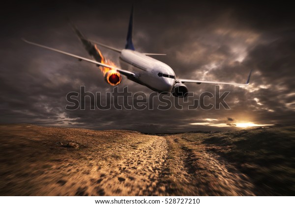 White plane with engine on fire about to crash\
in the landscape