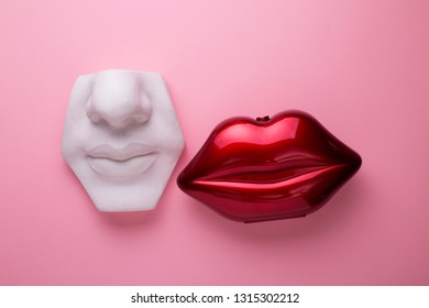 White Plaster Mouth Model And Red Shiny Female Mouth Lips, Beauty Standards Concept Or Lips Augmentation