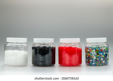 White Plastic Beads On Wood  Background, Polymers Bead Or Polymer Resin, Polymer Pallet, Product From Petrochemical Plants. Granules Polymer,