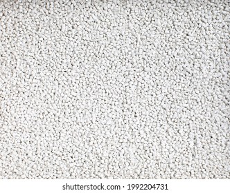 White Plastic Resin, Dyed Synthetic Polymer Resins. Pellets Material Factory. Banner Background And Texture Concept.