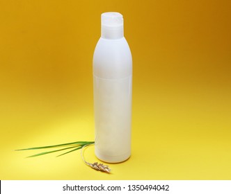 White Plastic Tube With Round Cap On Yellow Background. Cream Jar, Cosmetic Bottle Set. Glass Pack Mockup. Set Of Cosmetic Containers 
On Yellow Background.