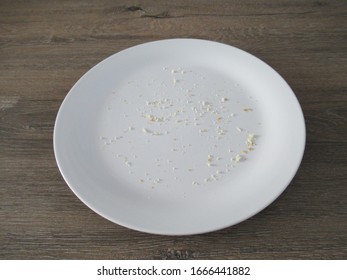 White Plate With Bread Crumbs