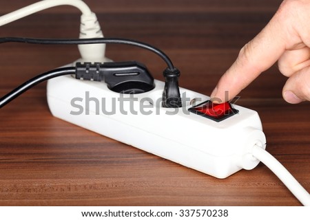 white plug socket on a wooden table